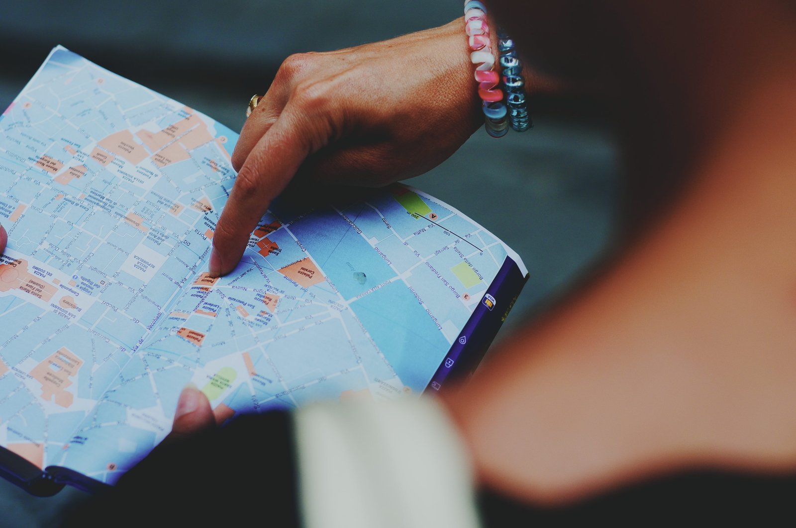 A person pointing to a map